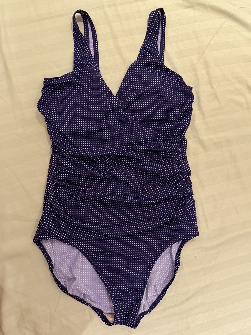 Navy Blue Polka Dot One Piece Swimsuit (Category: Bikinis & Swimsuits) located in Quezon City. Submitted by caathhx_ (Listing ID 1467510281, Image 1). Description: - Navy blue one-piece swimsuit with cute white polka dots - Flattering V-neckline with a wrapped front design and side ruching - Built-in light beige soft bra cups for comfortable support - Secure wide shoulder straps and classic high-cut legs - Chic scoop back style, ideal for beach t