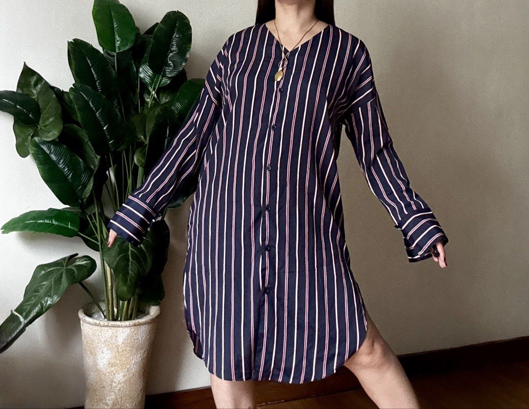 Navy Blue Striped Button-Down Dress,m to l (Category: Dresses) located in Mandaluyong City. Submitted by roxieeeeeee (Listing ID 1467519830, Image 2). Description: - Color & Pattern: Navy blue with vertical white and pink stripes - Design: Button-down front closure with matching buttons and a flattering V-neckline - Sleeves: Long sleeves with stylish wide cuffs - Fit & Length: Midi length featuring high side slits on both sides and a curved hemli