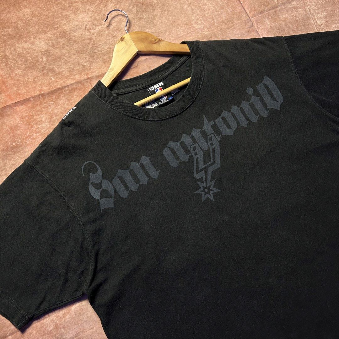 NBA SAN ANTONIO SCRIPT TEE (Category: Activewear) located in Dasmarinas. Submitted by 2slickdeals_ (Listing ID 1467411427, Image 2). Description: SIZE LARGE 21 WIDTH 29 LENGTH VERY GOOD CONDITION ISSUE: MINOR LINT. COLOR RATE: 9 / 10 J&T / LALAMOVE / MEET UPS!.