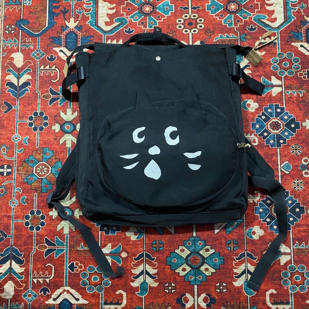 Ne-net x Issey Miyake Backpack (Category: Backpacks) located in Antipolo. Submitted by bentakahitanoano (Listing ID 1467487822, Image 1). Description: Ne-net "Nya" Black Cat 2-Way Backpack, an archival gem heavily sought after in Japanese streetwear and archive fashion communities Ne-net, designed by Kazuaki Takashima under the Issey Miyake group, is famous for its whimsical, quirky characters, and "Nya" the black cat is the brand’s most iconic m