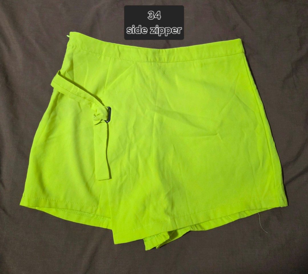 Neon Yellow Skort Size 34 Side Zipper (Category: Shorts) located in Paranaque City. Submitted by franinnashop (Listing ID 1467477832, Image 1). Description: DECLUTTER SIZE 34 PARANAQUE CITY - Size: 34 - Color: Bright neon yellow - Design: Wrap-around front panel with side belt detail - Closure: Convenient side zipper - Pockets: Two decorative faux pockets on the back - Styling: Great to pair with basic tops and sneakers for a vibrant, casual look