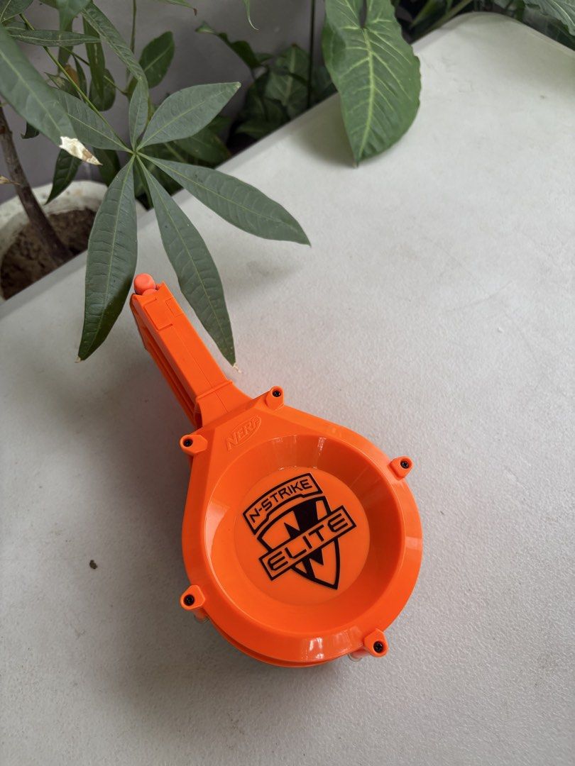 Nerf N-Strike Elite 25-Dart Drum Magazine (Category: Action & Battle Toys) located in Paranaque City. Submitted by marketbasket (Listing ID 1467544849, Image 1). Description: - Genuine orange Nerf drum magazine for N-Strike Elite blasters - High capacity: holds up to 25 darts - Clear back panel for quick and easy ammo checks - Built-in front winding crank ensures smooth dart feeding - Compatible with all standard clip-system Nerf blasters - Great