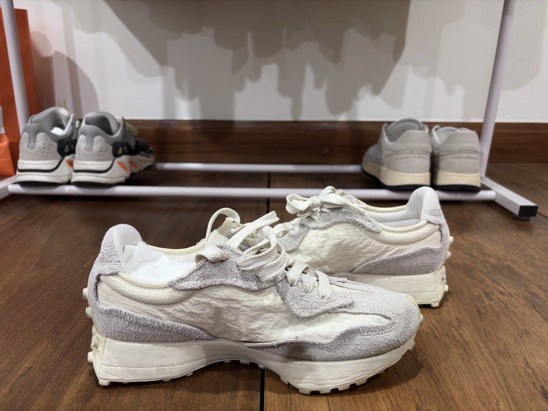 New Balance 327 White Grey (Category: Casual Shoes) located in Mandaluyong City. Submitted by antownr (Listing ID 1465067089, Image 2). Description: - Model: New Balance 327 - Colorway: Off-white and grey - Materials: Textured suede overlays with wrinkled nylon base - Soles: Chunky nubbed rubber outsole for excellent grip - Detail: 'The Intelligent Choice' text on the tongue - Condition: Comfortable everyday trainers with visible wear on soles an