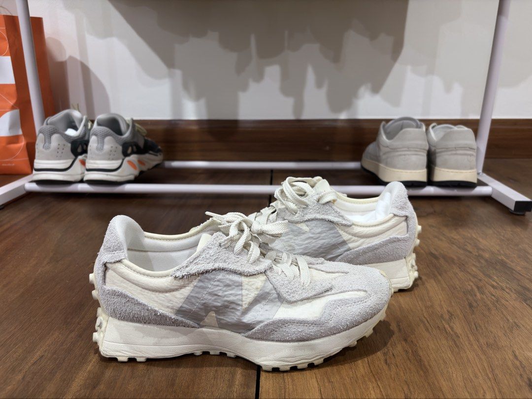 New Balance 327 White Grey (Category: Casual Shoes) located in Mandaluyong City. Submitted by antownr (Listing ID 1465067089, Image 1). Description: - Model: New Balance 327 - Colorway: Off-white and grey - Materials: Textured suede overlays with wrinkled nylon base - Soles: Chunky nubbed rubber outsole for excellent grip - Detail: 'The Intelligent Choice' text on the tongue - Condition: Comfortable everyday trainers with visible wear on soles an