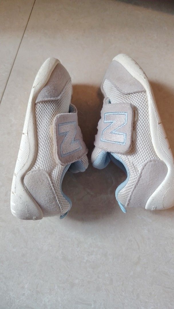 New Balance US7 13.5cm (Category: Babies & Kids Fashion) located in Quezon City. Submitted by waemierrie (Listing ID 1467465110, Image 2). Description: Original NB shoes. Easy to put on and color is baby blue. Signs of usage but already washed. This is US7 and fits 13.5cm feet. Please refer to pics for the complete size details... Sf is 44 via j&t Grey and light blue New Balance first baby shoes in size infant. Features a breathable mesh upper wi