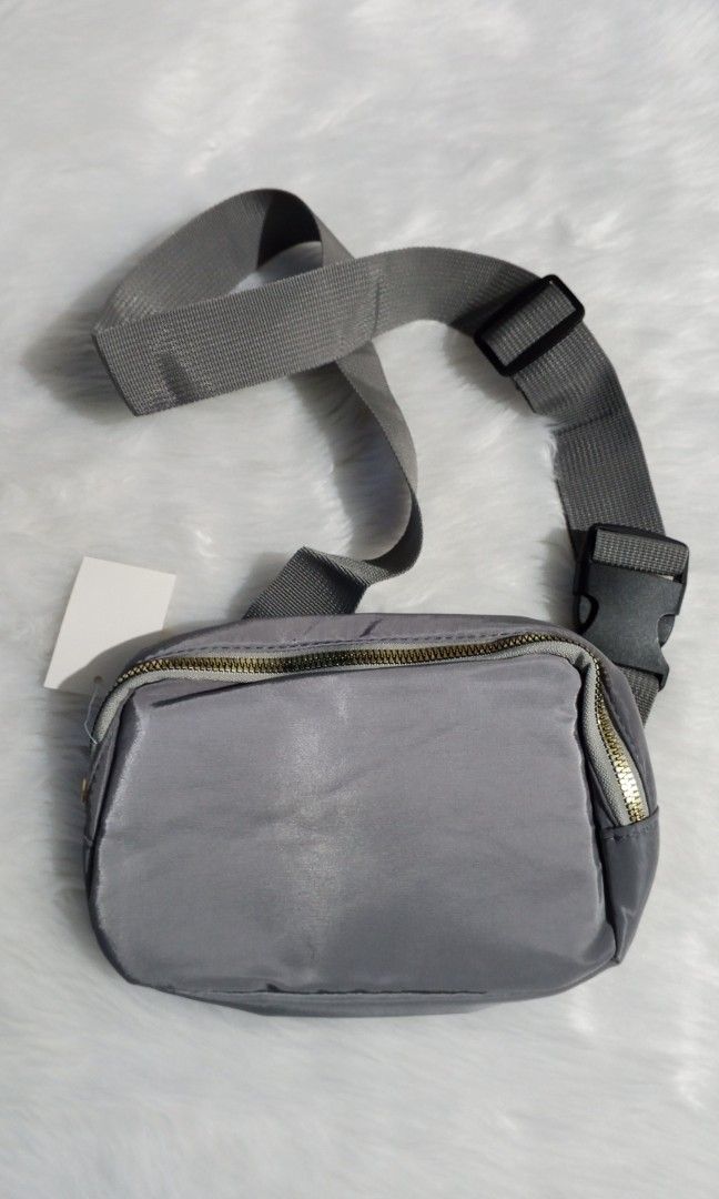 New gray sling bag (Category: Sling Bags) located in Cavite. Submitted by newmango.95cecd (Listing ID 1467480216, Image 1). Description: No brand • Unisex No issues! it's NEW! Loc: Silang, Cavite 📦 Delivery: Lalamove or J&T only.