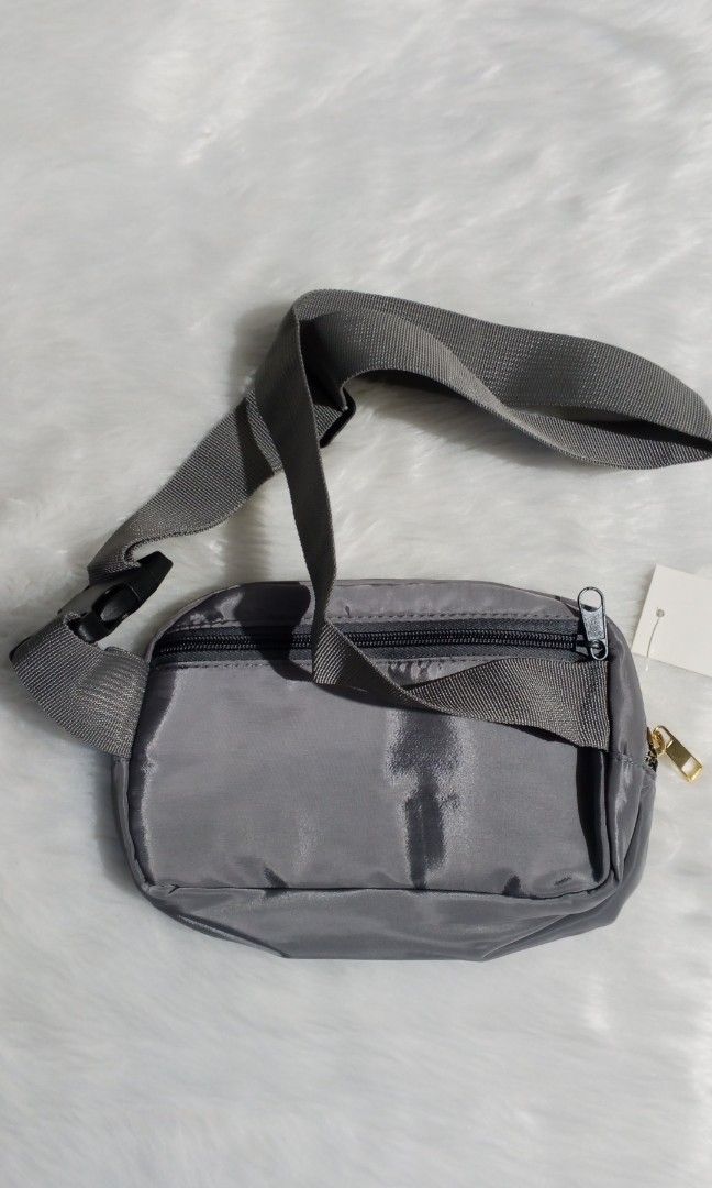 New gray sling bag (Category: Sling Bags) located in Cavite. Submitted by newmango.95cecd (Listing ID 1467480216, Image 2). Description: No brand • Unisex No issues! it's NEW! Loc: Silang, Cavite 📦 Delivery: Lalamove or J&T only.