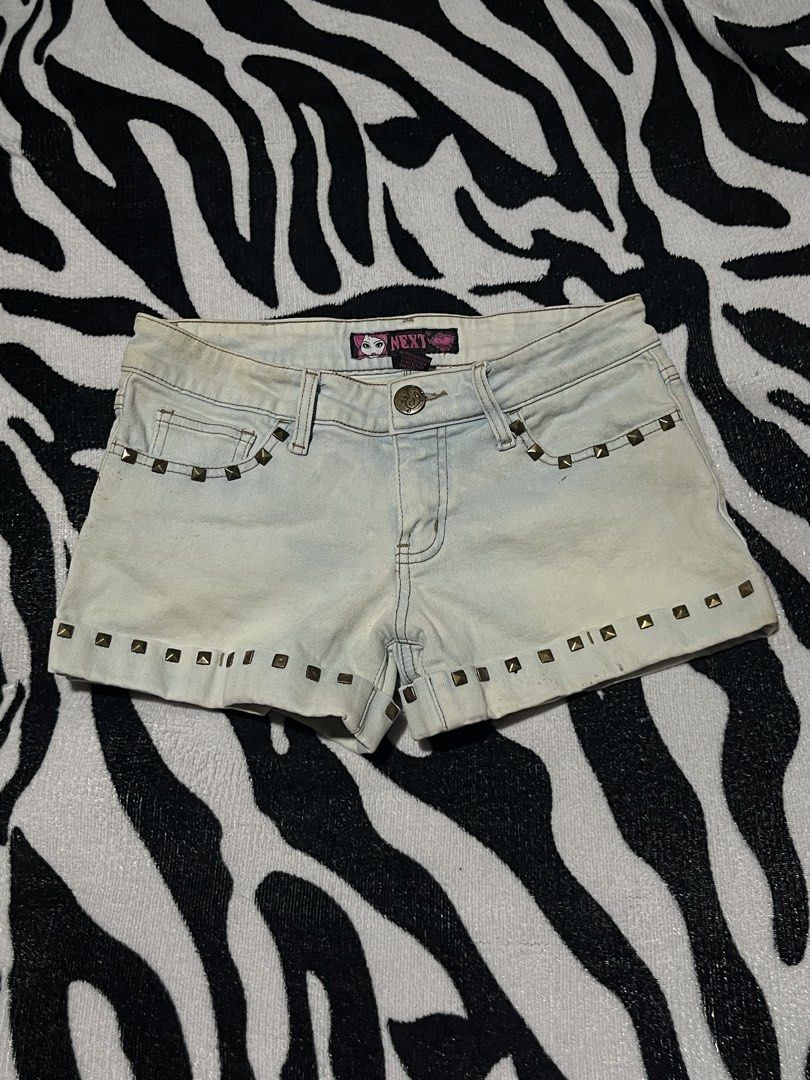 Next denim shorts studded y2k grunge medium size (Category: Shorts) located in Manila. Submitted by y2kcloset_ (Listing ID 1467476424, Image 1). Description: - Brand: Next - Size: Medium - Color: Light wash blue - Details: Studded front pockets and hem, branded waistband tag - Closure: Button and zipper fly - Style: Vintage 2000s / Grunge aesthetic.