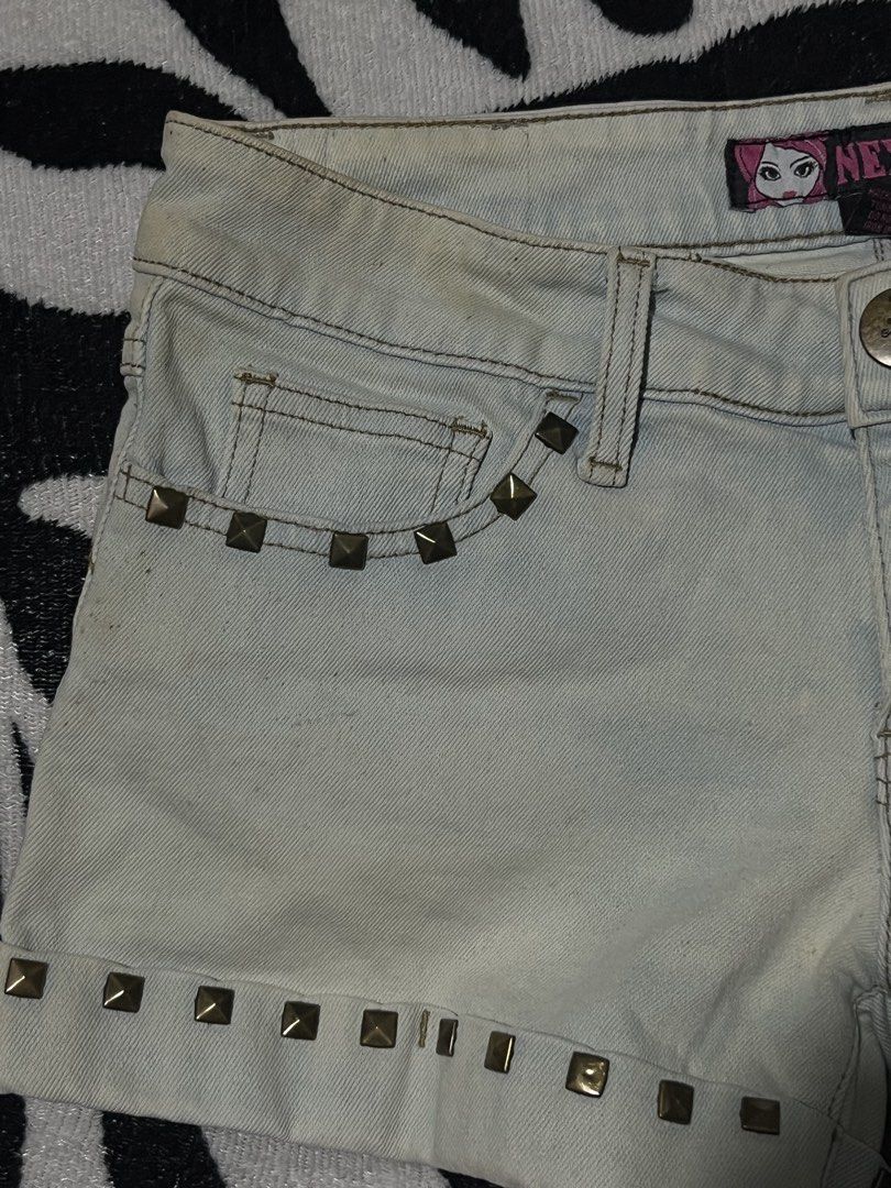 Next denim shorts studded y2k grunge medium size (Category: Shorts) located in Manila. Submitted by y2kcloset_ (Listing ID 1467476424, Image 3). Description: - Brand: Next - Size: Medium - Color: Light wash blue - Details: Studded front pockets and hem, branded waistband tag - Closure: Button and zipper fly - Style: Vintage 2000s / Grunge aesthetic.