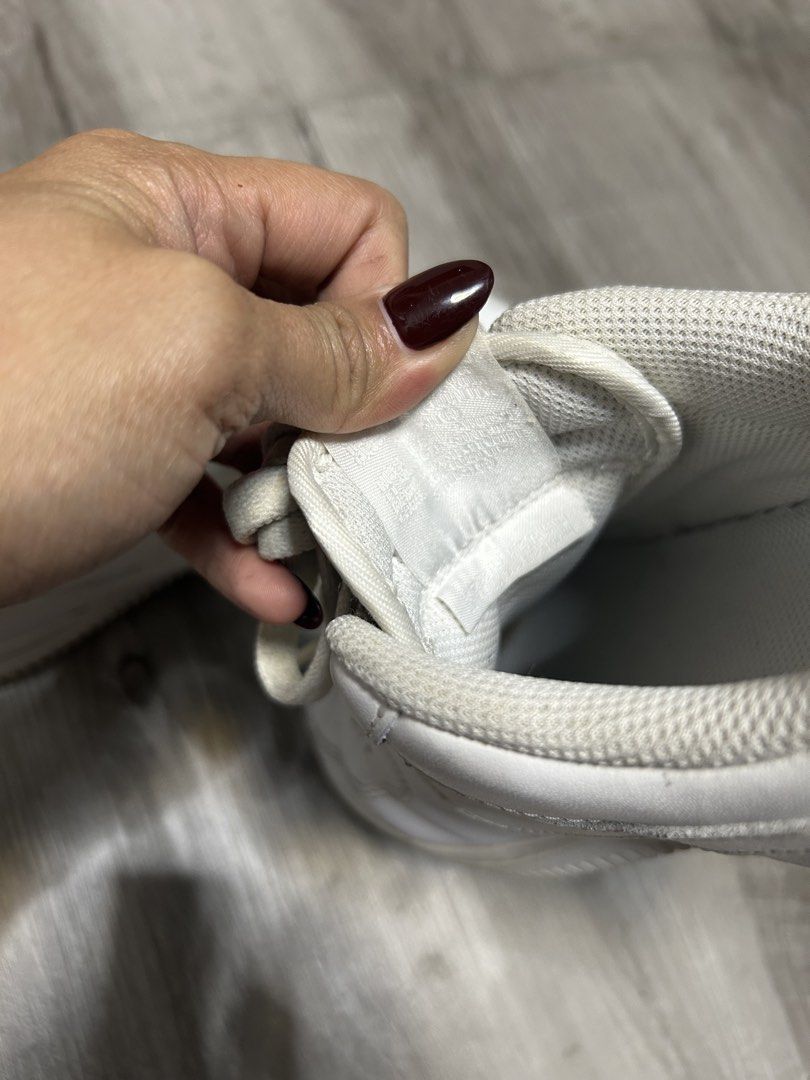 Nike Air Force 1 Low White (Category: Sneakers) located in Quezon City. Submitted by dKPopStore (Listing ID 1467441546, Image 3). Description: - Brand: Nike - Model: Air Force 1 Low (Triple White) - Size: US 7 / EUR 38 - Material: Clean leather upper with perforated toe box and silver AF1 lace dubraes - Sole: Standard rubber cupsole with Nike Air cushioning - Condition: Pre-owned with minor toe box creasing and slight dirt on soles/lining from no