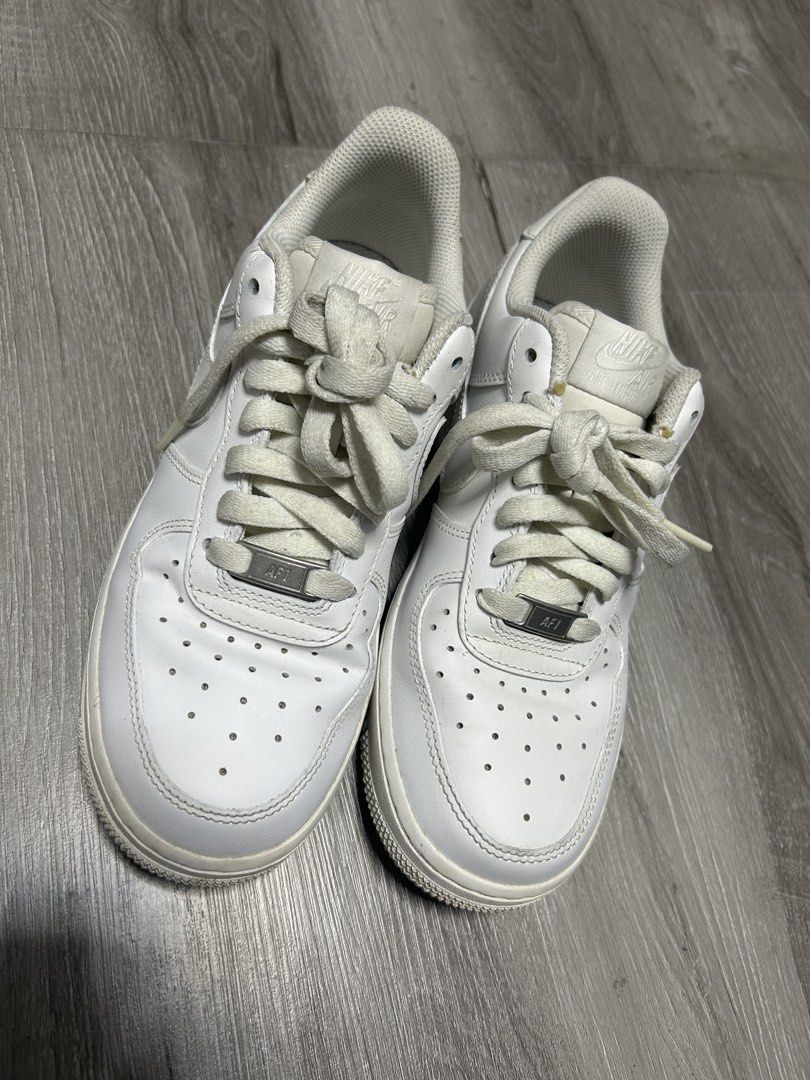 Nike Air Force 1 Low White (Category: Sneakers) located in Quezon City. Submitted by dKPopStore (Listing ID 1467441546, Image 1). Description: - Brand: Nike - Model: Air Force 1 Low (Triple White) - Size: US 7 / EUR 38 - Material: Clean leather upper with perforated toe box and silver AF1 lace dubraes - Sole: Standard rubber cupsole with Nike Air cushioning - Condition: Pre-owned with minor toe box creasing and slight dirt on soles/lining from no