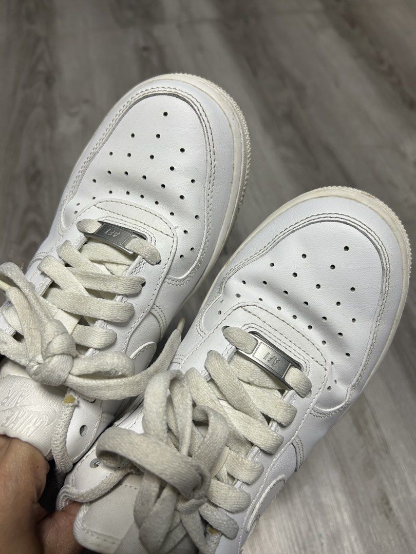 Nike Air Force 1 Low White (Category: Sneakers) located in Quezon City. Submitted by dKPopStore (Listing ID 1467441546, Image 2). Description: - Brand: Nike - Model: Air Force 1 Low (Triple White) - Size: US 7 / EUR 38 - Material: Clean leather upper with perforated toe box and silver AF1 lace dubraes - Sole: Standard rubber cupsole with Nike Air cushioning - Condition: Pre-owned with minor toe box creasing and slight dirt on soles/lining from no