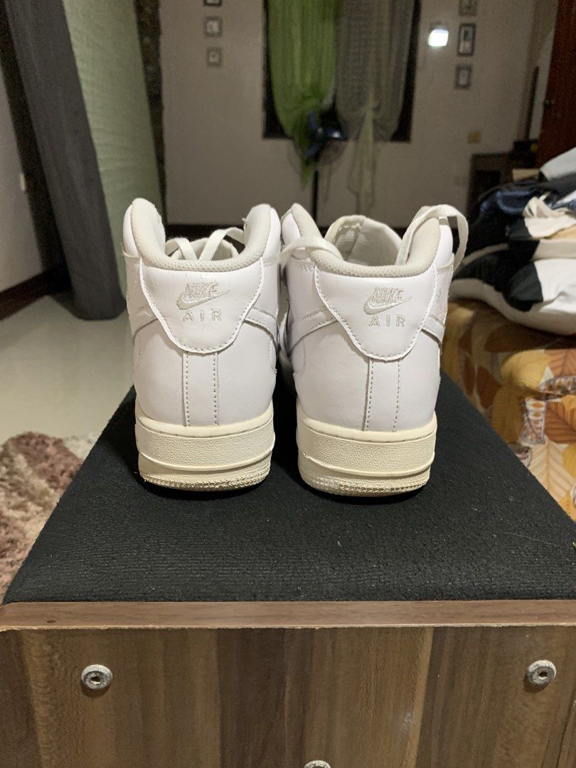 Nike Air Force 1 Mid White Sneakers (Category: Sneakers) located in Manila. Submitted by rain_dreams (Listing ID 1467469595, Image 1). Description: - Authentic Nike Air Force 1 Mids (All-White) - Iconic leather upper with toe box perforations - Comfortable Nike Air cushioning and metallic AF1 lace dubraes - Condition: Regular wear with minor toe box creasing and slight midsole yellowing - Soles: Still have plenty of life left - Laces: Clean and f