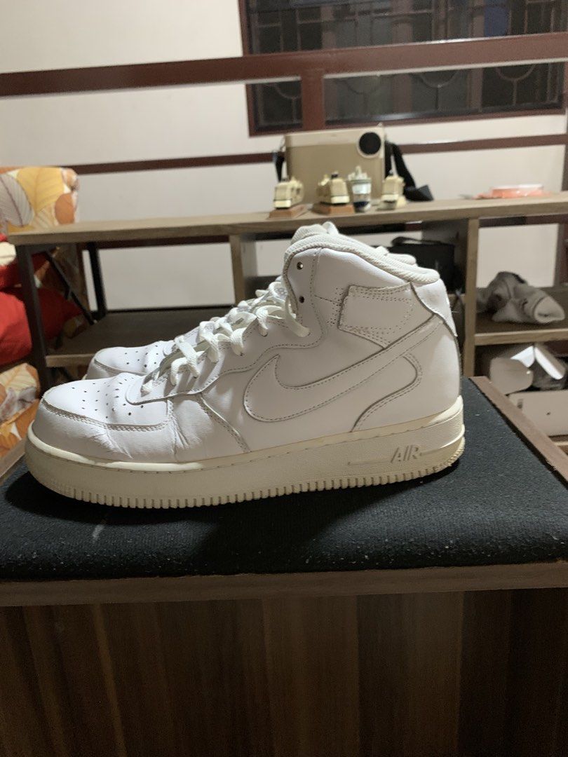 Nike Air Force 1 Mid White Sneakers (Category: Sneakers) located in Manila. Submitted by rain_dreams (Listing ID 1467469595, Image 2). Description: - Authentic Nike Air Force 1 Mids (All-White) - Iconic leather upper with toe box perforations - Comfortable Nike Air cushioning and metallic AF1 lace dubraes - Condition: Regular wear with minor toe box creasing and slight midsole yellowing - Soles: Still have plenty of life left - Laces: Clean and f