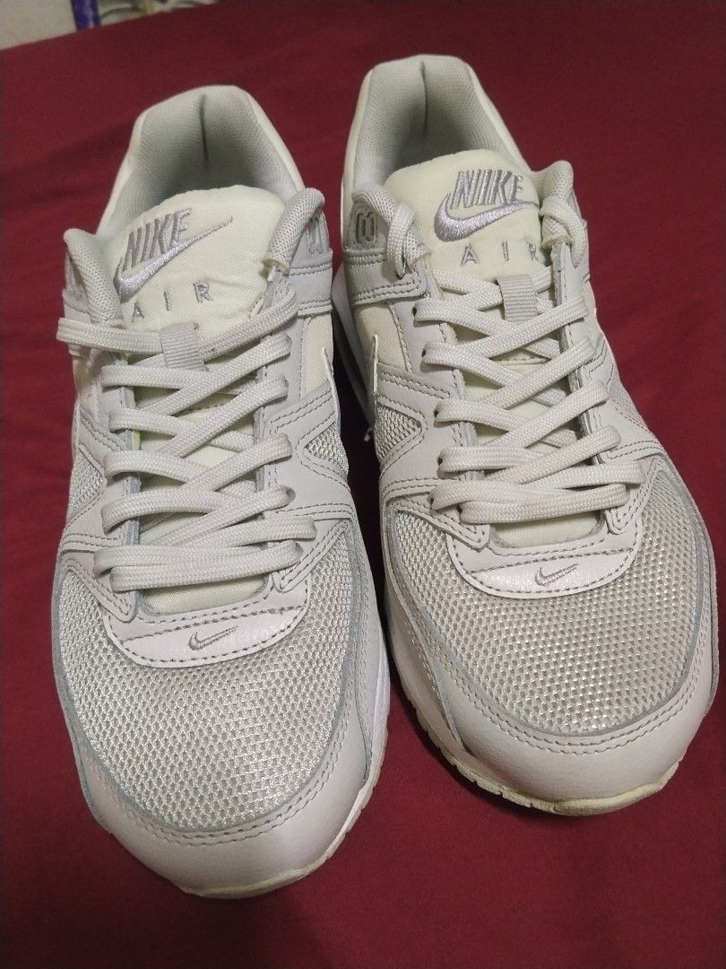 Nike Air Max Command Light Grey Sneakers (Category: Sneakers) located in Baliuag. Submitted by Bacon (Listing ID 1467387687, Image 3). Description: - Brand/Model: Nike Air Max Command - Colorway: Neutral Grey and White - Size: US 7.5 / UK 5 / EUR 38.5 (24.5 cm) - Materials: Mesh upper with durable leather overlays - Features: Visible Air unit in the heel for cushioning, signature waffle rubber outsole - Condition: Light dirt on soles. Used a few 