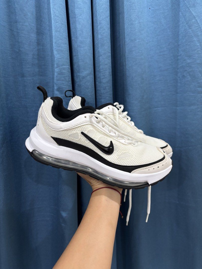Nike Air Max White and Black Sneakers (Category: Sneakers) located in Digos. Submitted by kathydiane76376 (Listing ID 1467529664, Image 1). Description: - Brand: Nike Air Max - Colorway: Classic White and Black with black side swooshes and toe box swoosh - Material/Design: Breathable mesh upper, chunky sole with visible air unit, 'AIR' lettering on heel tabs, and rear pull tab - Inclusions: Comes with original white laces - Condition: Clean, well