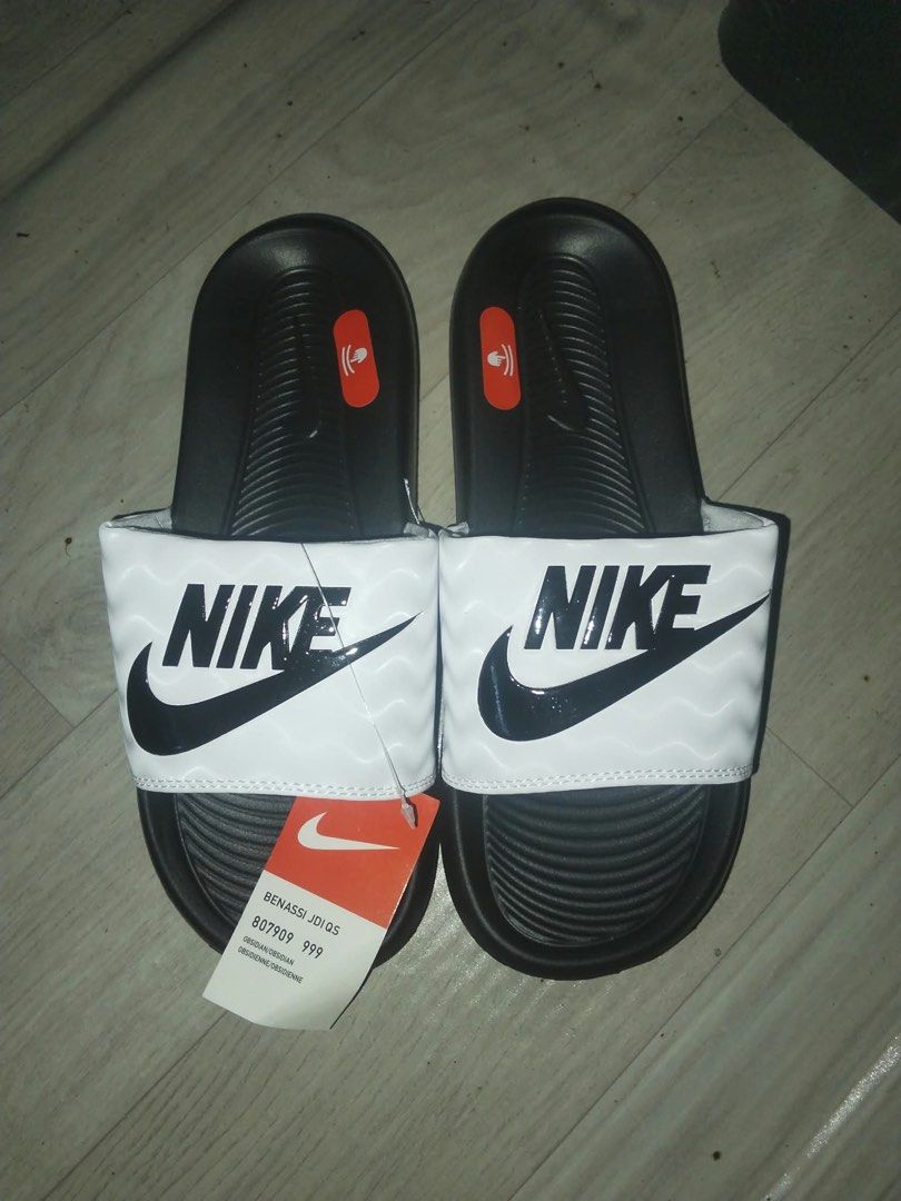 Nike Benassi Slides (Category: Slippers & Slides) located in Manila. Submitted by vast.althea_08 (Listing ID 1467478121, Image 3). Description: Nike Benassi Slides For Sale‼️ PHP 280 EACH Colors Available w/ Size • Green | Size 8 & 10 •Grey | Size 11 •White | Size 8 •Black | Size 11 📍 Location: Quezon City 📌 SF is not included in the selling price. 📦 Shipping fee will be shouldered by the buyer..