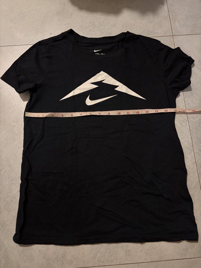 Nike Black Tee - hiking shirt (Category: Activewear) located in Manila. Submitted by nicoleaaa (Listing ID 1467457582, Image 1). Description: - Brand: Nike - Color: Black with white mountain & swoosh graphic - Fit: Standard fit, short sleeve, regular crew neck - Material: Soft cotton feel for everyday comfort - Length: Approx. 24 inches (see flat-lay photo) - Condition: Excellent casual daily wear piece.