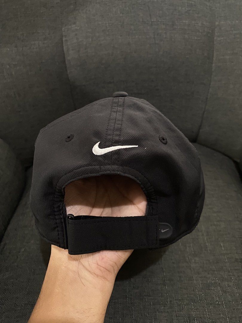 Nike cap (Category: Caps & Hats) located in Bulacan. Submitted by _myarchive (Listing ID 1467381868, Image 2). Description: - Brand: Nike Golf - Color: Black with white embroidered swoosh (front and back) - Style Code: 727042-010 - Material: 100% polyester body and lining (lightweight and breathable) - Fit: Adjustable velcro strap with subtle Nike branding - Condition: Clean inner tags (nikebetterworld.com) - Ideal for: Golf, outdoor sports, or e