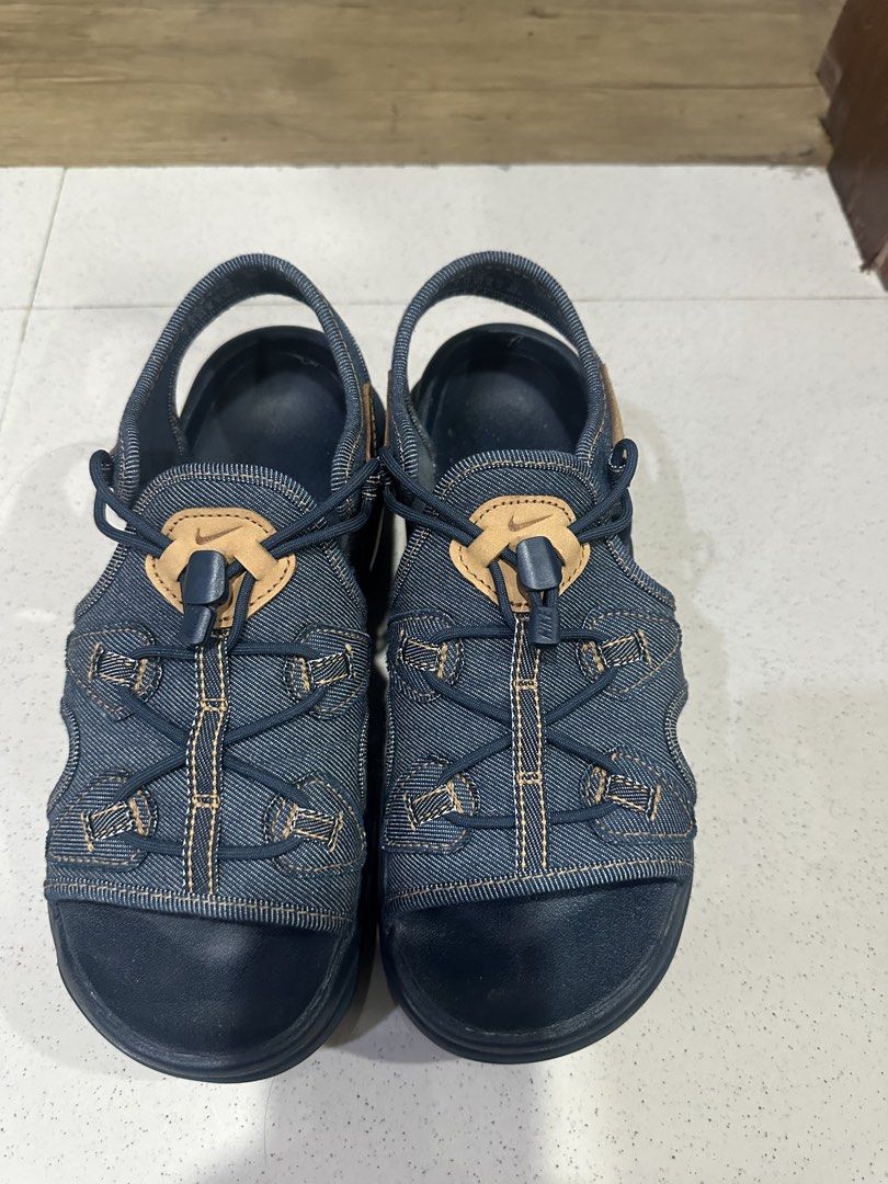 Nike Denim Sandals with Toggle Lacing (Category: Flats & Sandals) located in Manila. Submitted by kcsq95 (Listing ID 1467377839, Image 1). Description: - Brand: Nike - Style: Denim sandals with dark blue wash and brown leather accents - Fit: Quick-lace toggle system and secure heel strap - Comfort: Contoured footbed for extra grip - Sole: Durable rubber sole - Best for: Casual daily walks or beach trips.