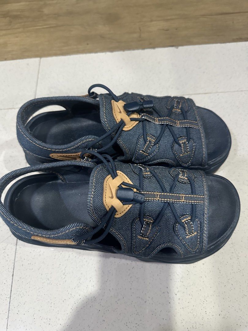 Nike Denim Sandals with Toggle Lacing (Category: Flats & Sandals) located in Manila. Submitted by kcsq95 (Listing ID 1467377839, Image 2). Description: - Brand: Nike - Style: Denim sandals with dark blue wash and brown leather accents - Fit: Quick-lace toggle system and secure heel strap - Comfort: Contoured footbed for extra grip - Sole: Durable rubber sole - Best for: Casual daily walks or beach trips.