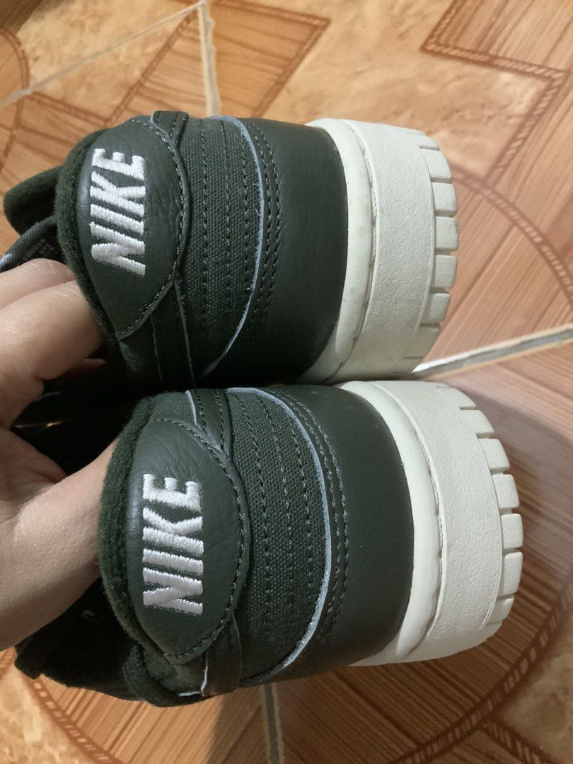 Nike Dunk Low Olive Green Sneakers (Category: Sneakers) located in Caloocan City. Submitted by Twinsters_2nd (Listing ID 1467369729, Image 3). Description: - Brand: Nike Dunk Low - Colorway: Dark Olive Green with Cream White midsole - Materials: Durable canvas base with premium leather overlays - Details: Contrast white Nike heel tab and tongue branding, matching dark olive laces and lining - Design: Classic low-top skate silhouette with textured