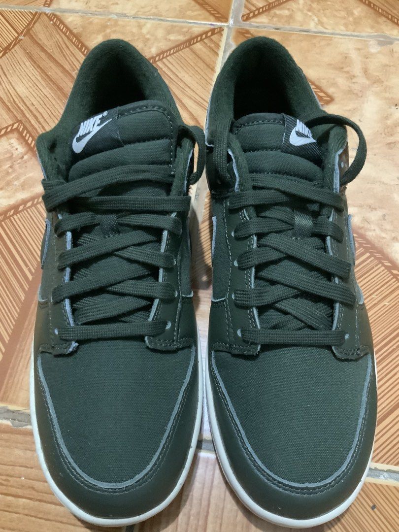 Nike Dunk Low Olive Green Sneakers (Category: Sneakers) located in Caloocan City. Submitted by Twinsters_2nd (Listing ID 1467369729, Image 1). Description: - Brand: Nike Dunk Low - Colorway: Dark Olive Green with Cream White midsole - Materials: Durable canvas base with premium leather overlays - Details: Contrast white Nike heel tab and tongue branding, matching dark olive laces and lining - Design: Classic low-top skate silhouette with textured