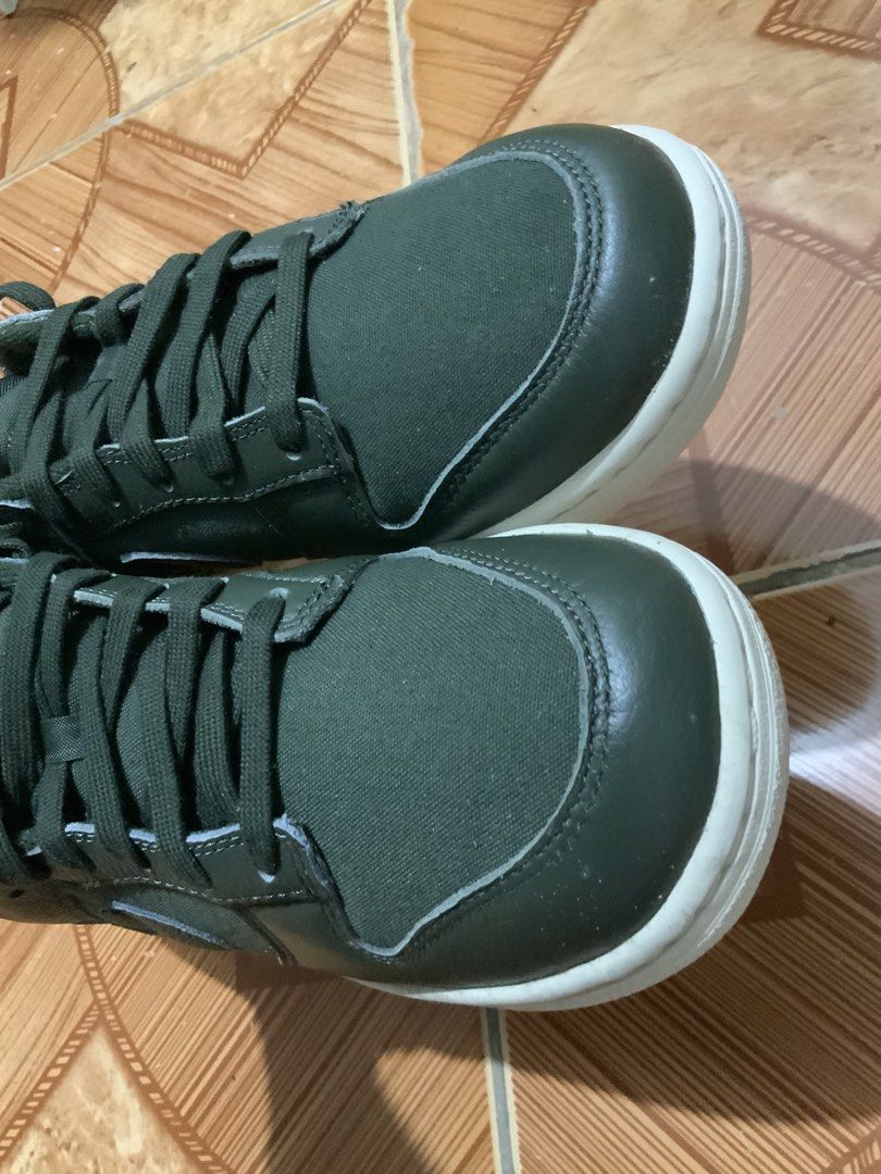 Nike Dunk Low Olive Green Sneakers (Category: Sneakers) located in Caloocan City. Submitted by Twinsters_2nd (Listing ID 1467369729, Image 2). Description: - Brand: Nike Dunk Low - Colorway: Dark Olive Green with Cream White midsole - Materials: Durable canvas base with premium leather overlays - Details: Contrast white Nike heel tab and tongue branding, matching dark olive laces and lining - Design: Classic low-top skate silhouette with textured
