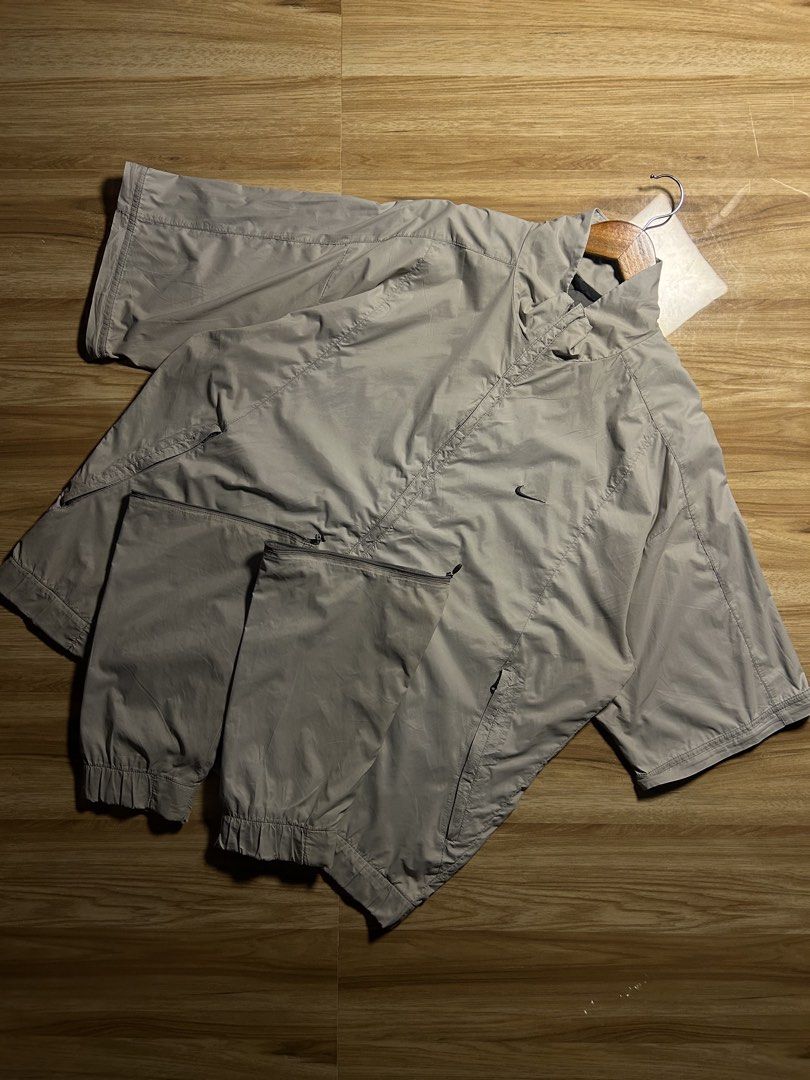 Nike Golf Grey Convertible Windbreaker Jacket (Category: Coats, Jackets and Outerwear) located in Tarlac. Submitted by selfmade_legacy (Listing ID 1467484394, Image 2). Description: - Brand: Nike Golf - Style: Convertible windbreaker jacket with zip-off sleeves (transforms into short sleeves) - Color: Classic grey - Size: XL - Features: Full-zip front, lightweight material, sleek minimalist branding - Condition: Excellent pre-owned condition - Pe