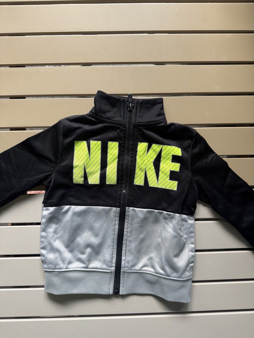 Nike Jacket for baby (Category: Babies & Kids Fashion) located in Paranaque City. Submitted by april_anythingpreloved (Listing ID 1467477915, Image 1). Description: - Authentic Kids Nike full zip jacket - Size on tag: 2T (can fit up to 3 years old) - Stylish black top with neon green logo & grey bottom half - High collar and full front zip closure for extra warmth - Soft, comfortable athletic fabric - Great outer layer for school, casual wear, or