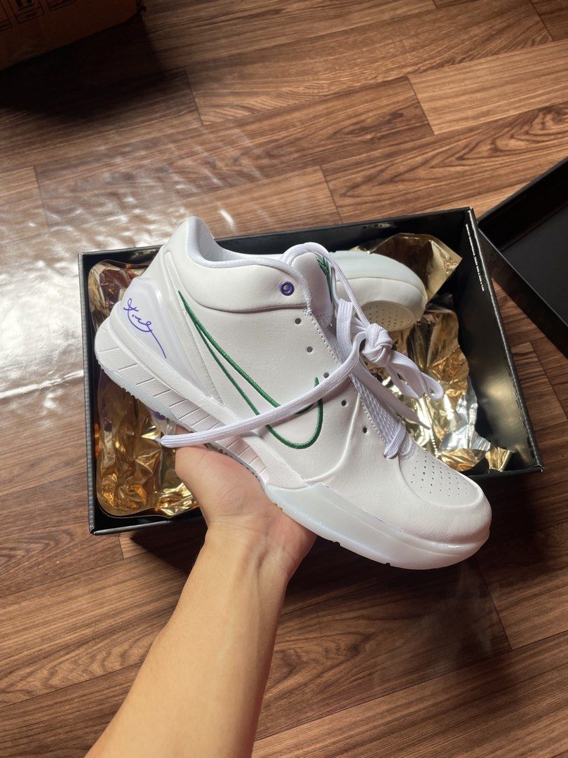 Nike Kobe IV Protro Draft Day US 9.5 (Category: Sneakers) located in San Pedro. Submitted by mharemilvalencia (Listing ID 1467535291, Image 2). Description: Nike Kobe IV Protro sneakers in the Draft Day colorway. White leather upper, green swoosh, purple accents on the heel and collar. Back heels embroidered with numbers 8 and 24. Includes original box, wrapping, and extra purple laces. Men size 9.5, women size 11. Clean outsoles, never worn..