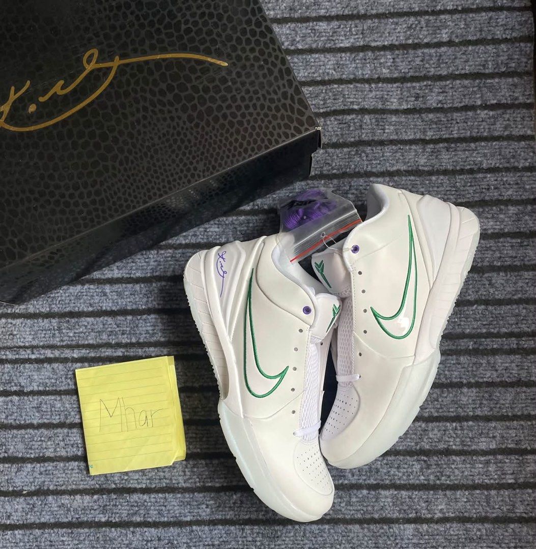 Nike Kobe IV Protro Draft Day US 9.5 (Category: Sneakers) located in San Pedro. Submitted by mharemilvalencia (Listing ID 1467535291, Image 1). Description: Nike Kobe IV Protro sneakers in the Draft Day colorway. White leather upper, green swoosh, purple accents on the heel and collar. Back heels embroidered with numbers 8 and 24. Includes original box, wrapping, and extra purple laces. Men size 9.5, women size 11. Clean outsoles, never worn..