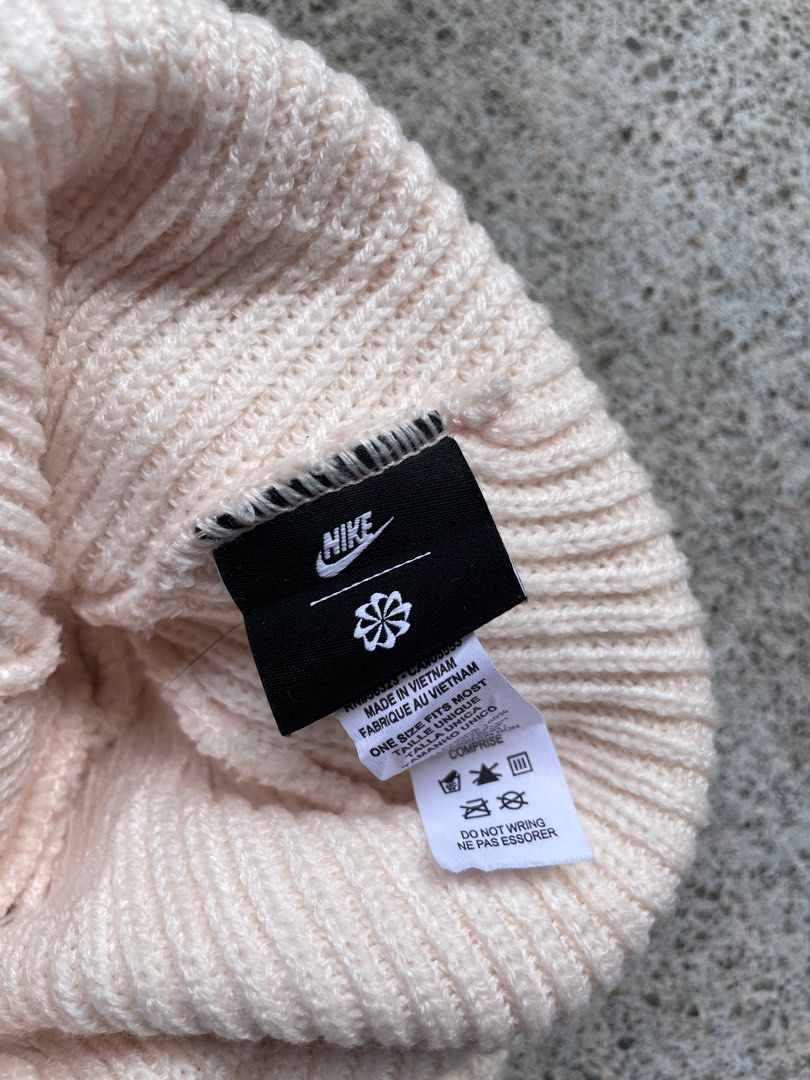 Nike Peak Beanie Off-White Ribbed Knit Hat (Category: Hats & Beanies) located in Siniloan. Submitted by rethr1ft (Listing ID 1467420362, Image 2). Description: - Brand: Nike - Style: Peak Beanie - Color: Off-white - Material: 100% polyester (body & lining) - Condition: Clean with tags attached inside - Size: One size fits most - Features: Ribbed knit with front Nike logo patch - Origin: Made in Vietnam.