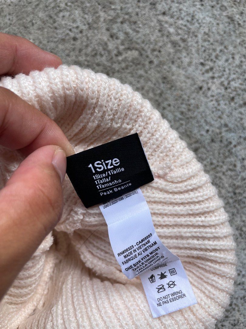 Nike Peak Beanie Off-White Ribbed Knit Hat (Category: Hats & Beanies) located in Siniloan. Submitted by rethr1ft (Listing ID 1467420362, Image 3). Description: - Brand: Nike - Style: Peak Beanie - Color: Off-white - Material: 100% polyester (body & lining) - Condition: Clean with tags attached inside - Size: One size fits most - Features: Ribbed knit with front Nike logo patch - Origin: Made in Vietnam.