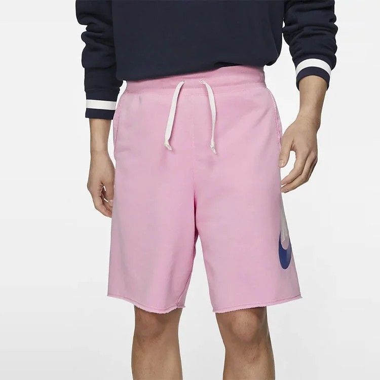 Nike Pink Sweatshorts with Big Logo (Category: Shorts) located in Davao. Submitted by vernoneighty4 (Listing ID 1467477002, Image 1). Description: - Brand: Nike - Item: Pink fleece sweatshorts - Size: Medium (tag attached) - Details: White drawstring waistband, raw cut hem, practical side pockets - Graphic: Large white and blue Nike logo on the left leg - Material: Comfortable cotton blend - Origin: Made in Thailand - Style: Casual streetwear sta