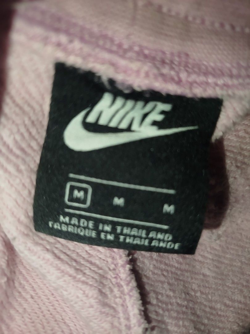 Nike Pink Sweatshorts with Big Logo (Category: Shorts) located in Davao. Submitted by vernoneighty4 (Listing ID 1467477002, Image 3). Description: - Brand: Nike - Item: Pink fleece sweatshorts - Size: Medium (tag attached) - Details: White drawstring waistband, raw cut hem, practical side pockets - Graphic: Large white and blue Nike logo on the left leg - Material: Comfortable cotton blend - Origin: Made in Thailand - Style: Casual streetwear sta