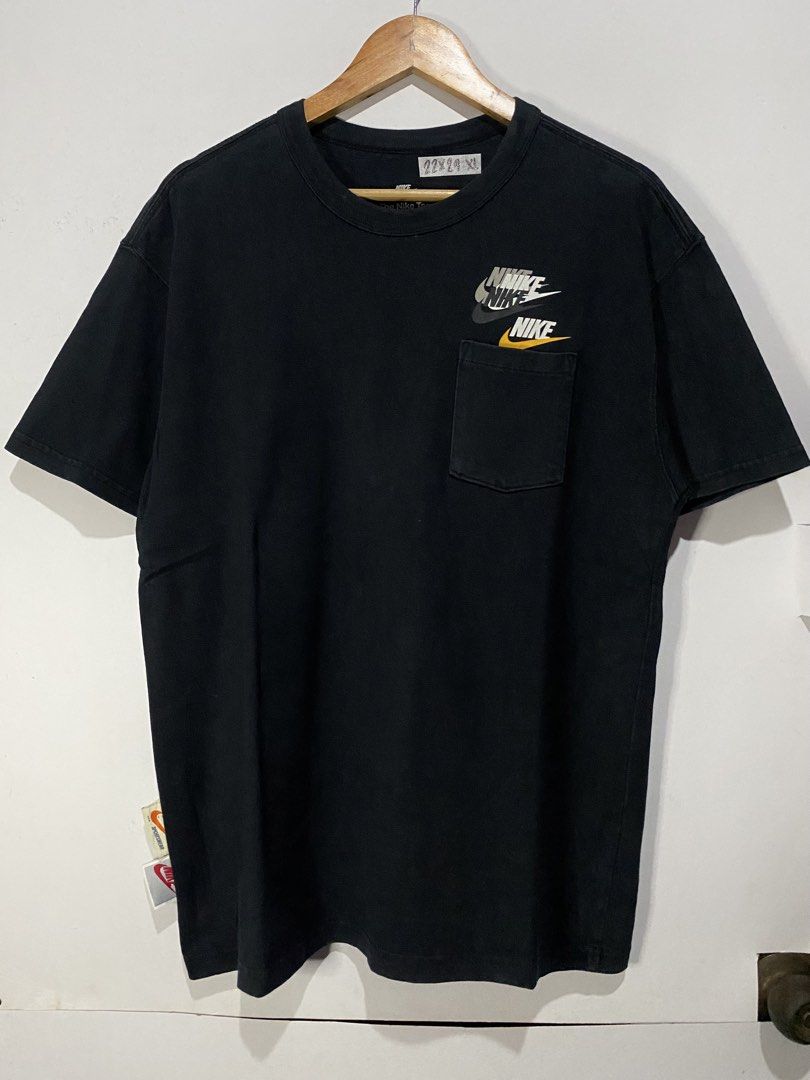 Nike Pocket T-Shirt Black Multiple Logos (Category: Tshirts & Polo Shirts ) located in Jaen. Submitted by oshimamark58418 (Listing ID 1467549620, Image 1). Description: - Brand: Nike - Color: Black - Size: Large - Pit to Pit: 22 inches - Length: 29 inches - Features: Layered chest logo graphics, single chest pocket, and special stitched branding tags near the hem - Origin: Made in China - Condition: Excellent pre-owned condition.