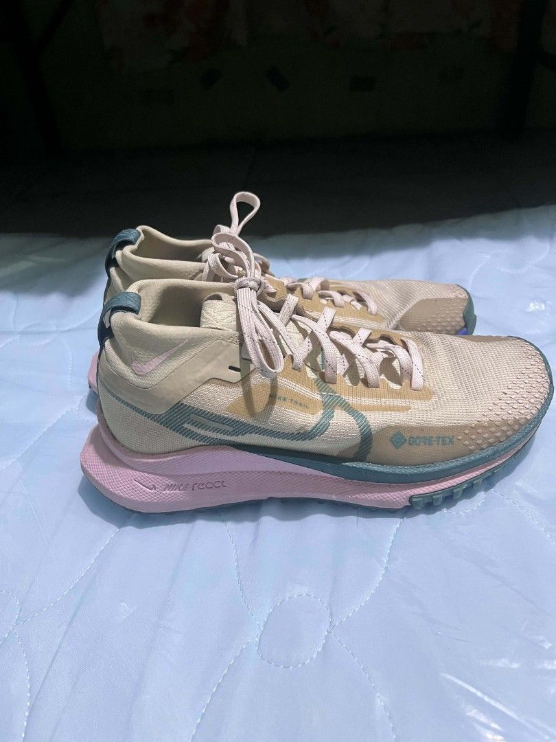 Nike React Pegasus Trail 4 GORE-TEX Women's (Category: Sneakers) located in Dasmarinas. Submitted by preloved_japan_items (Listing ID 1467524824, Image 3). Description: - Brand/Model: Nike React Pegasus Trail 4 GORE-TEX (Women's) - Colorway: Beige and pink with blue accents - Size: US 5 / EUR 35.5 can fit sa size 36 - Features: Waterproof GORE-TEX upper & plush React foam midsole - Condition: Lightly worn, clean treads and uppers - Best for: Trai