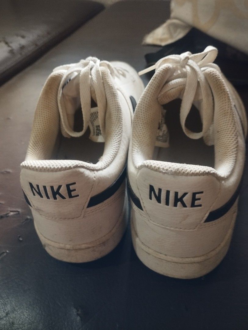 NIKE SHOES ORIGINAL SIZE 10 (Category: Sneakers) located in Mandaluyong City. Submitted by LEATHERFACE (Listing ID 1467396129, Image 2). Description: - Color: White with black Nike swoosh and heel branding - Material: Premium white leather upper with breathable perforated toe box - Sole: Clean flat rubber cupsole for daily comfort - Style: Versatile everyday casual staple that matches almost any outfit - Condition: Normal signs of wear on the upp