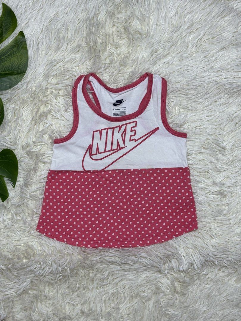 Nike Toddler Tank Top (Category: Babies & Kids Fashion) located in Dagupan City. Submitted by iamrannflores (Listing ID 1467409645, Image 1). Description: - Brand: Nike - Size: 2T (Fits ages 1-2 years / 85-90cm) - Design: White top section with pink Nike logo and swoosh, paired with a pink polka-dot bottom half - Details: Cute pink trim around the neckline and arm openings - Origin: Made in Indonesia - Condition: Brand new/ odličan quality (ready