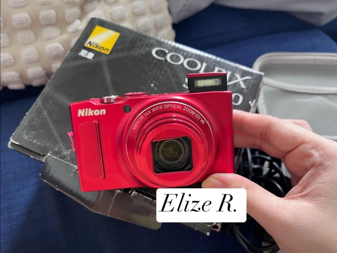 Nikon Coolpix S8200 Red Digital Camera with Box (Category: Cameras) located in Imus. Submitted by elishenggg (Listing ID 1467422099, Image 1). Description: - Model: Nikon Coolpix point-and-shoot camera - Color: Bright red - Lens & Flash: 14x wide optical zoom lens with built-in pop-up flash - Condition: Great working condition, perfect for everyday use - Inclusions: Original box, carrying case, and charging cables included - Portability: Compact 