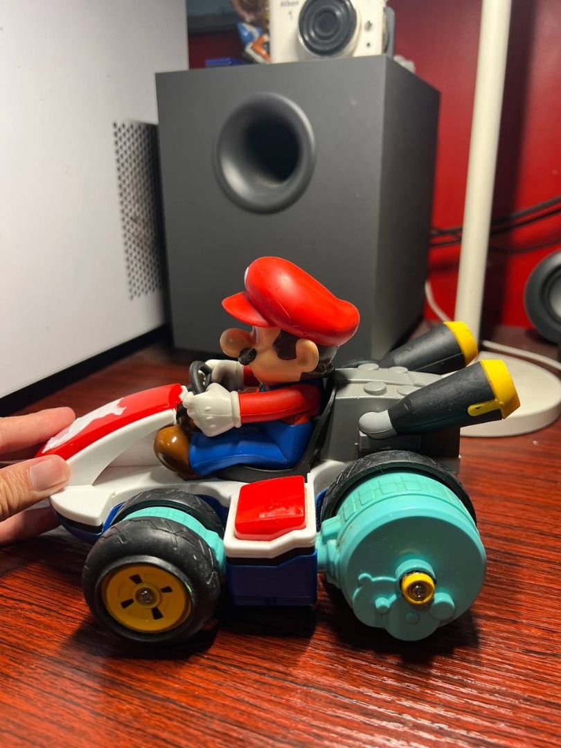 Nintendo Mario Kart RC (USED) (Category: Vehicle & Diecast Models) located in Baguio. Submitted by ditoyzb08176 (Listing ID 1467518897, Image 2). Description: - Mario figure driving a classic white and red kart with blue wheels and rear booster pipes - Fully functional wheels that roll properly - Fantastic display piece for any Nintendo or Mario fan - Flaw note: Noticeable white residue/sticker residue on the front red hood -missing rubber sa isa