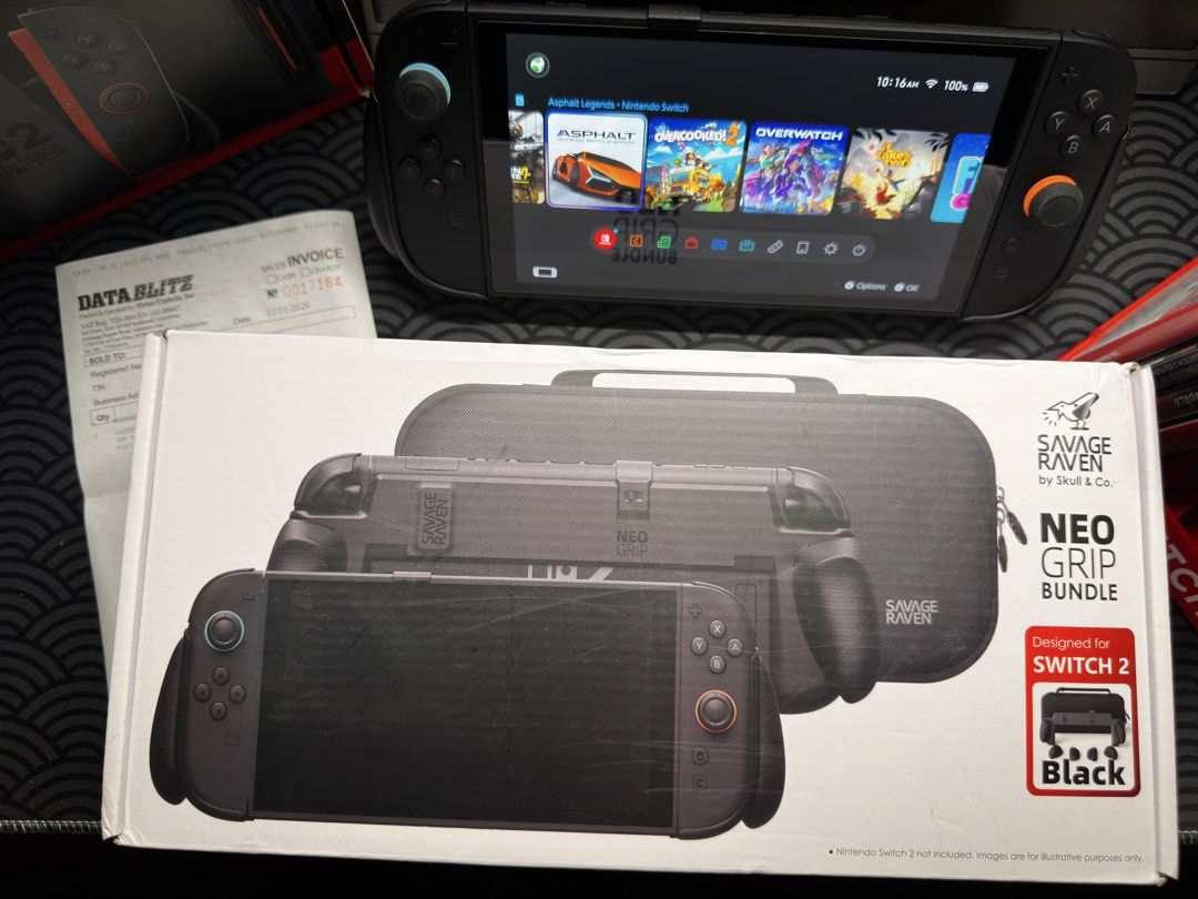 Nintendo Switch 2 Console Bundle with Savage Raven Neo Grip (Category: Nintendo) located in Manila. Submitted by jaydeevina31055 (Listing ID 1467602778, Image 2). Description: - Nintendo Switch 2 console with original box and Data Blitz receipt - Equipped with TransNovo Screen Protector (with 1 extra screen protector - Savage Raven Neo Grip case and black carrying case included - Pre-loaded with top games: Asphalt Legends, Overcooked 2, Overwatch