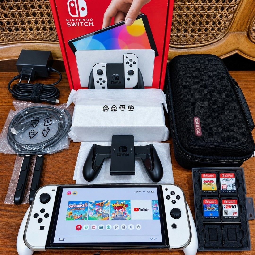 Nintendo Switch OLED Complete wit 4 Games (Category: Nintendo) located in Manila. Submitted by kmswitchhubph (Listing ID 1467389907, Image 1). Description: FOR SALE • FOR SALE • FOR SALE ✨ NINTENDO SWITCH OLED (WHITE) GOOD AS NEW WITH 4 GAMES 📦 COMPLETE ACCESSORIES WITH BOX • Original Joycon grip • Original Joycon strap • Original Dock • Original HDMI • Original Charger 🎁 FREEBIES • Skull & Co. Carrying Case • Grip Case • Cartridge Case 🎮 4 PH