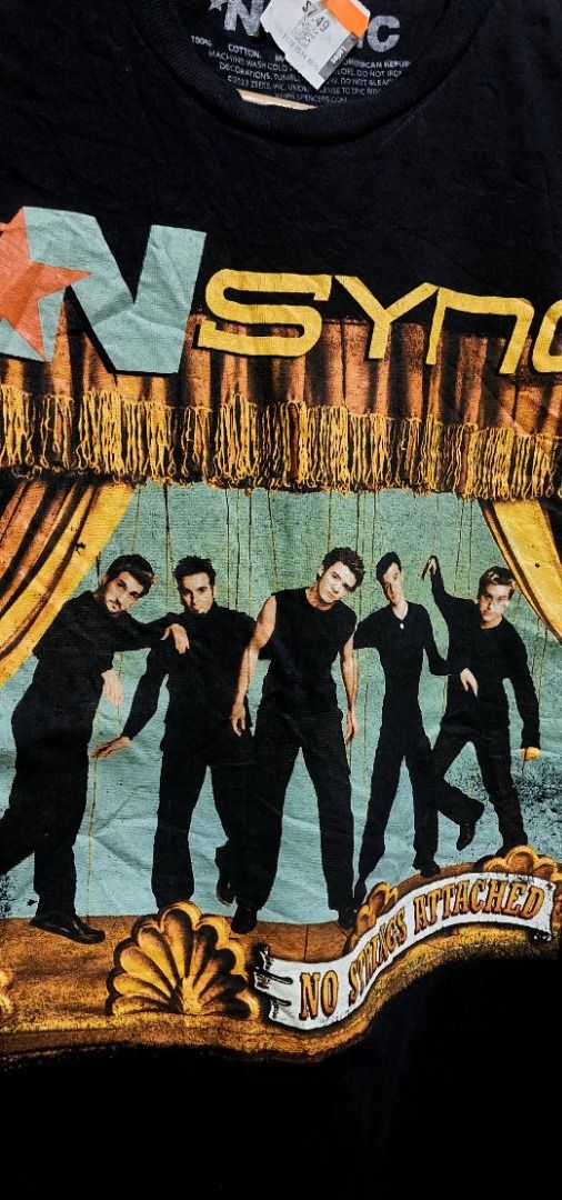 NSINC No Strings Attached Band T-Shirt Small (Category: Tshirts & Polo Shirts ) located in Legazpi City. Submitted by street_uniform (Listing ID 1467401738, Image 2). Description: - Dimes: W18.5 L26 - Brand: Official NSYNC merchandise from Spencer's (2023) - Design: Front graphic print with all five band members on stage and bold band logo - Size: Small (SM) - Material: 100% cotton, made in Dominican Republic - Fit: Regular fit with standard crew