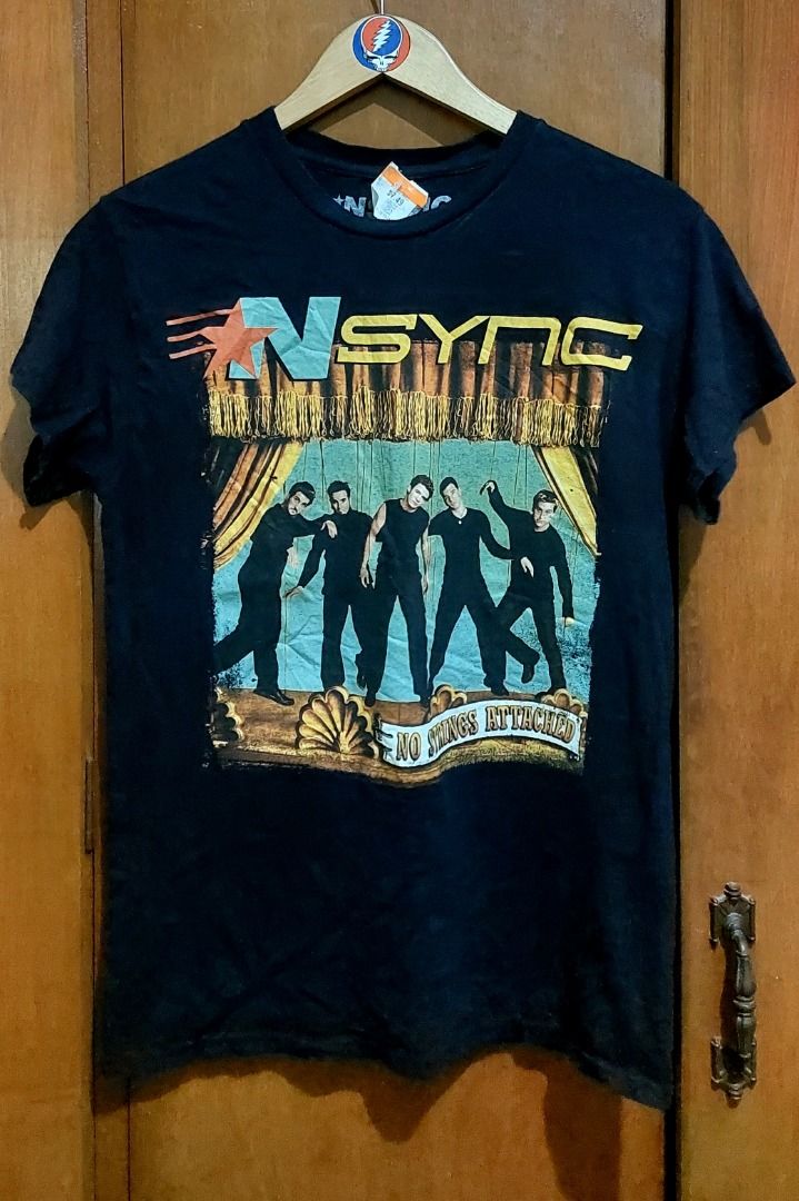 NSINC No Strings Attached Band T-Shirt Small (Category: Tshirts & Polo Shirts ) located in Legazpi City. Submitted by street_uniform (Listing ID 1467401738, Image 1). Description: - Dimes: W18.5 L26 - Brand: Official NSYNC merchandise from Spencer's (2023) - Design: Front graphic print with all five band members on stage and bold band logo - Size: Small (SM) - Material: 100% cotton, made in Dominican Republic - Fit: Regular fit with standard crew