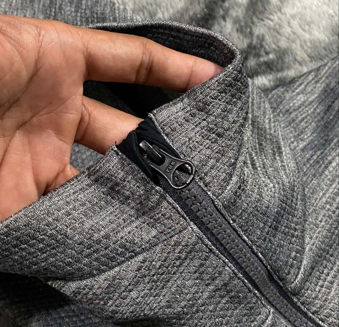 Oakley Performance Fit Grey Zip Hoodie (Category: Coats, Jackets and Outerwear) located in Sorsogon. Submitted by johnmichae69459 (Listing ID 1467513844, Image 3). Description: - Brand: Oakley - Color: Grey with textured fabric pattern - Size: US/EU Medium / Japan Large - 23 width - 27 lenght - Material: 100% Polyester - Features: Embroidered chest logo, high neck hood, smooth YKK zipper, and front pockets - Origin: Made in Myanmar - Condition: E