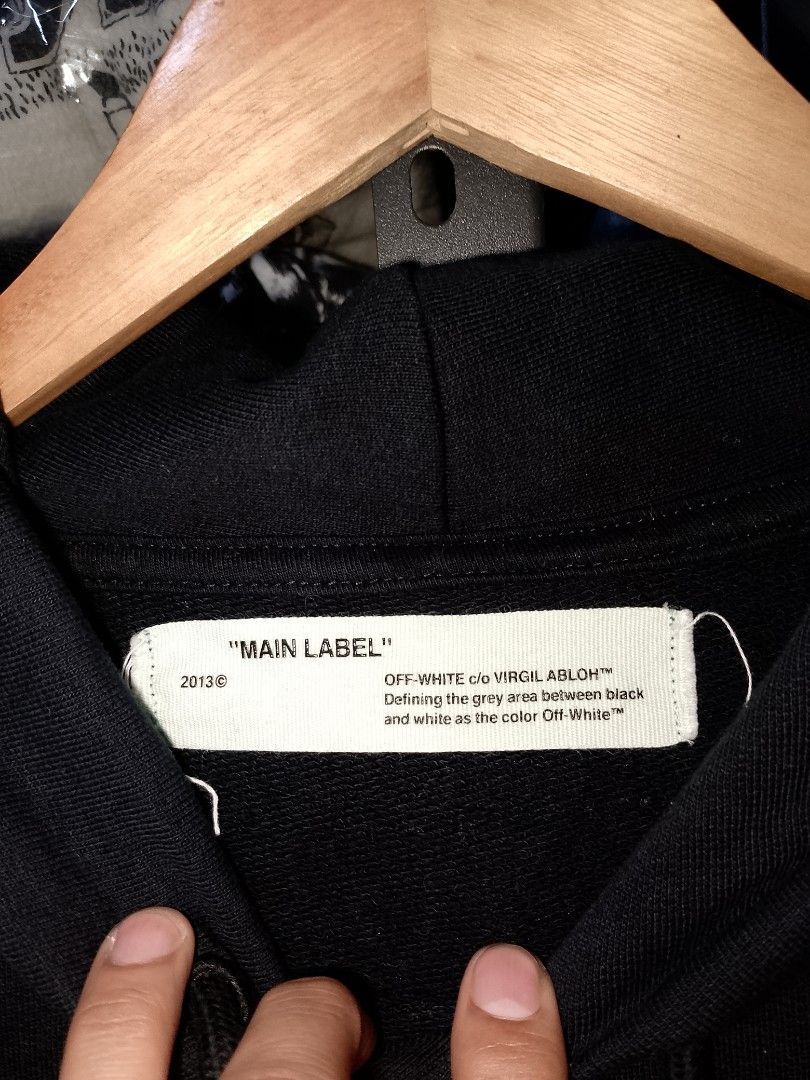 Off-White Flagship Store Two Year Anniversary Hoodie (Category: Coats, Jackets and Outerwear) located in Manila. Submitted by mjthrifted_second (Listing ID 1467421001, Image 2). Description: - Brand: Off-White - Collection: Flagship Store Two Year Anniversary - Color: Black - Size: Small -Dimes: 20/29 - Material: 100% cotton - Design: Front chest pocket with white graphic text and signature diagonal square prints - Features: Adjustable drawstring