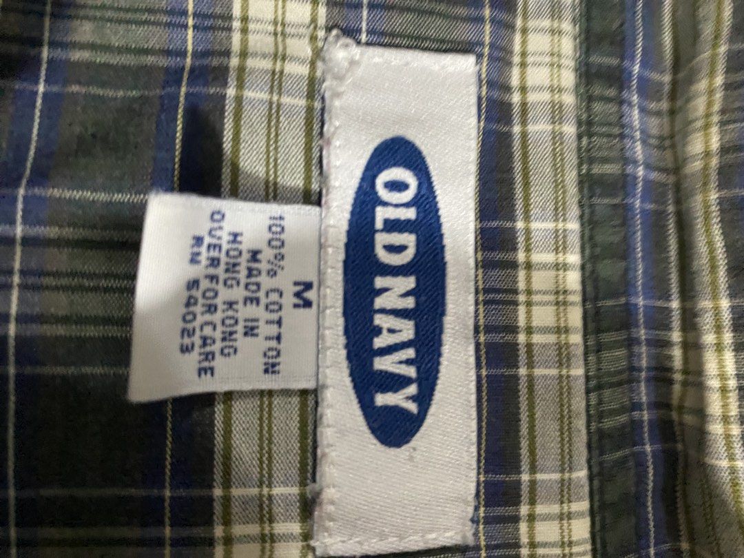 Old Navy Plaid Long Sleeve Button Down Shirt Medium (Category: Tshirts & Polo Shirts ) located in Imus. Submitted by just.randoms (Listing ID 1467557093, Image 2). Description: - Brand: Old Navy - Size: Medium - Color/Pattern: Blue, green, and white plaid - Material: 100% cotton - Details: Long sleeves with button cuffs, single left chest pocket, vintage Hong Kong manufacturing tag - Condition/Style: Classic casual piece, great for everyday wear.