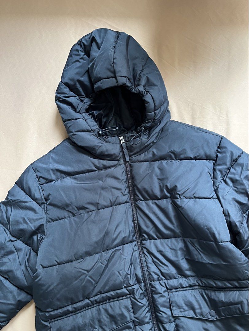Old Navy Puffer Jacket Navy Blue (Category: Coats, Jackets and Outerwear) located in Mandaluyong City. Submitted by lovedbykatc (Listing ID 1467417471, Image 2). Description: Hooded with adjustable drawstrings, zip front closure, two front pockets with button flaps. Already washed. Can pass as brand new. Measurements: Length - 77cm Width - 69cm My hubby wasn’t able to use it. Changed outfit. Bought from another carouseller. .